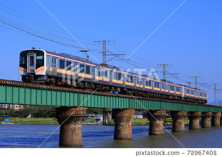 E129 series train crossing the Hakusan railway bridge 78967408