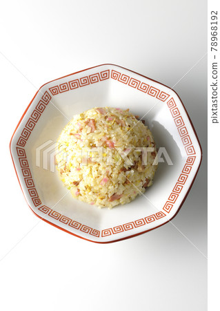 A bird's-eye view of a single Gomoku fried rice containing various ingredients such as Narutomaki and char siu on a white background A bird's-eye view of a single Gomoku fried rice containing various ingredients such as Narutomaki and char siu on a white background 78968192