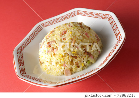 Photographed a single Gomoku fried rice with various ingredients such as Narutomaki and char siu on a red background Photographed a single Gomoku fried rice with various ingredients such as Narutomaki and char siu on a red background 78968215