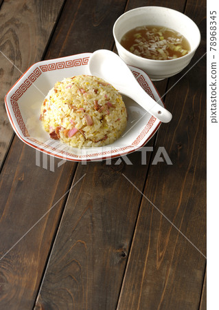 Gomoku fried rice and Chinese soup with various ingredients such as Narutomaki and char siu Gomoku fried rice and Chinese soup with various ingredients such as Narutomaki and char siu 78968345