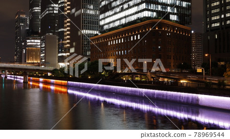 Skyscrapers in Osaka city such as the illuminated Dojima River revetment wall and the main building of Daibiru 78969544