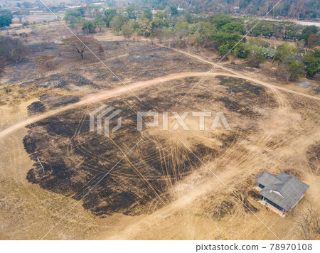 Aerial view of the burnt land after wildfire in Northern region of Thailand. Wildfires can occur naturally but many are caused by humans, accidentally or deliberately. Aerial view of the burnt land after wildfire in Northern region of Thailand. Wildfires can occur naturally but many are caused by humans, accidentally or deliberately. 78970108