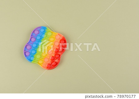 Bright colorful children's toy made of silicone designed to relieve stress Bright colorful children's toy made of silicone designed to relieve stress 78970177