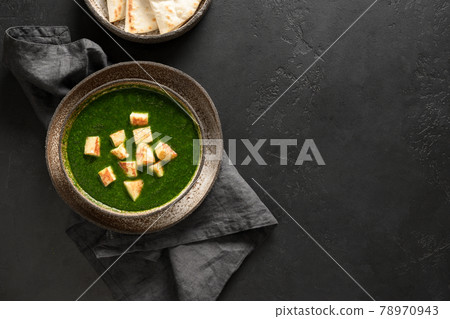 Palak paneer of spinach and cheese on black. Palak paneer of spinach and cheese on black. 78970943