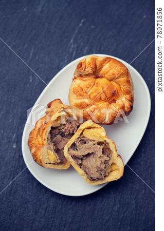 typical portuguese and brazilian chicken small pies on white dish typical portuguese and brazilian chicken small pies on white dish 78971856
