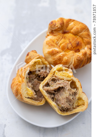 typical portuguese and brazilian chicken small pies on white dish 78971857
