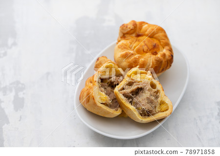 typical portuguese and brazilian chicken small pies on white dish typical portuguese and brazilian chicken small pies on white dish 78971858