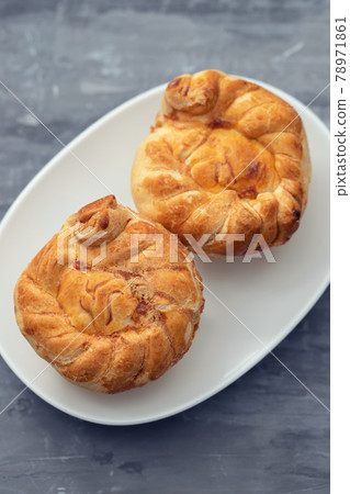 typical portuguese and brazilian chicken small pies on white dish 78971861