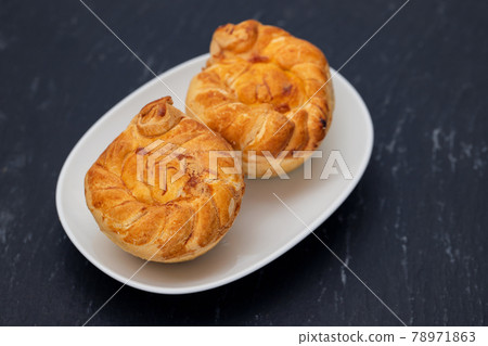 typical portuguese and brazilian chicken small pies on white dish typical portuguese and brazilian chicken small pies on white dish 78971863