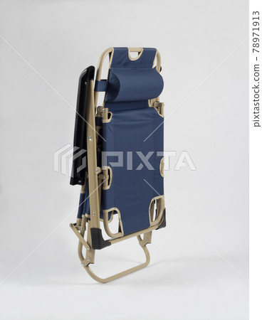 Folded up blue beach chair isolated on white 78971913