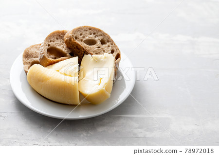 soft portuguese cheese with bread on white plate on ceramic background soft portuguese cheese with bread on white plate on ceramic background 78972018