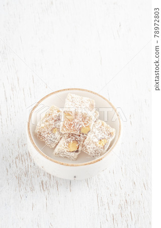 traditional Turkish delight with nut on table with copy space traditional Turkish delight with nut on table with copy space 78972803