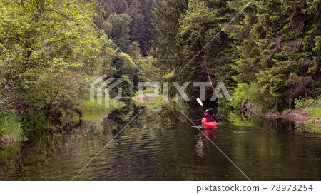 Adventure Caucasian Adult Woman Kayaking in Red Kayak 78973254