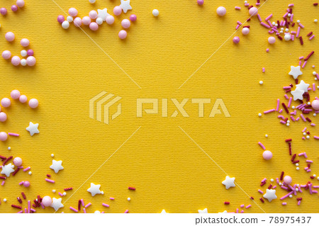 Decorations for pastry on yellow background. Cake decorating 78975437