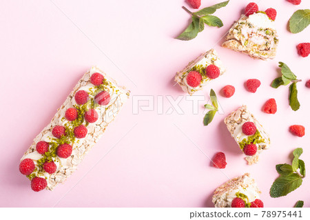 Dessert pistachio roll with raspberry filling. Food photo with space for text, concept of sweets Dessert pistachio roll with raspberry filling. Food photo with space for text, concept of sweets 78975441
