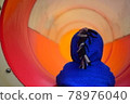 Children getting off the slide in the tunnel 78976040