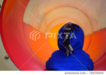 Children getting off the slide in the tunnel Children getting off the slide in the tunnel 78976040