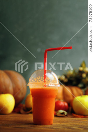 Pumpkins juice in bottles with pumpkins. Pumpkins juice in bottles with pumpkins. 78976100