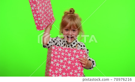 Cheerful stylish child girl opening gift box, great happiness amazement, satisfied with best present 78976216