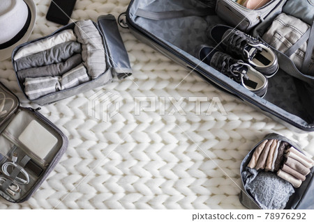 Top view composition with neatly packing things, clothes and accessories for travel konmari method 78976292