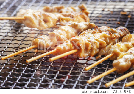 Image of grilling yakitori over charcoal 78981978