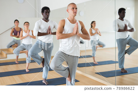 Man and woman making yoga meditation in lotus pose in fitness Man and woman making yoga meditation in lotus pose in fitness 78986622