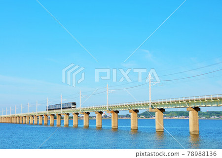 Ibaraki Prefecture Train running on the Kitaura Bridge in the blue sky 78988136