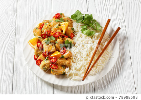 Mango glazed spicy chicken breast chunks with rice 78988598