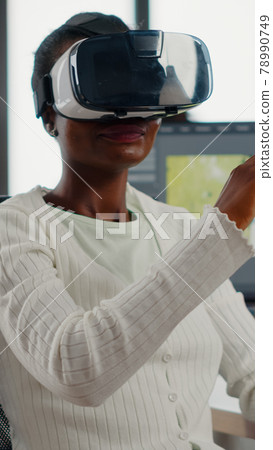 Black videographer wearing VR headset editing project Black videographer wearing VR headset editing project 78990749