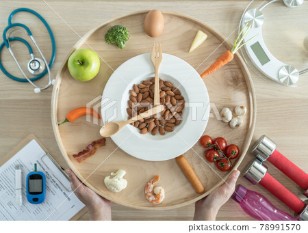 Intermittent fasting IF and keto diet concept with hour clock timer for skipping meal, eating ketogenic food low carb, high fat food meal healthy nutritional dish with gym exercise for weight loss 78991570