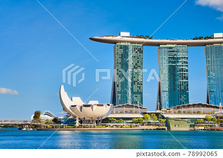 Iconic view of Marina Bay Sands , Shoppes mall, ArtScience museum, Helix bridge in Marina bay on sunny day. Famous landmarks of Singapore city-state.  78992065