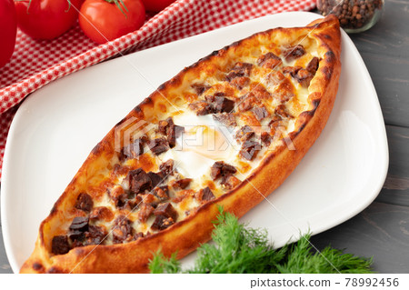 Close up of Turkish Pide bread on wooden table 78992456