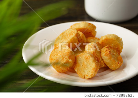 Baked small cheese cookies heap close up Baked small cheese cookies heap close up 78992623