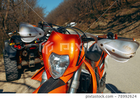 Close-up details of cross motorcycle parked on ground Close-up details of cross motorcycle parked on ground 78992624