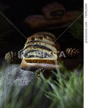 Poppy seed strudel on wooden rustic table. Traditional christmas strudel or Roll cake Poppy seed strudel on wooden rustic table. Traditional christmas strudel or Roll cake 78992890
