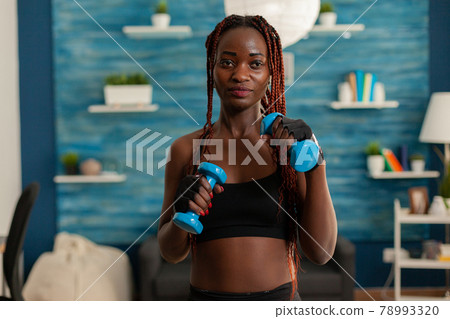 Black woman taking care of body working training arm muscles 78993320