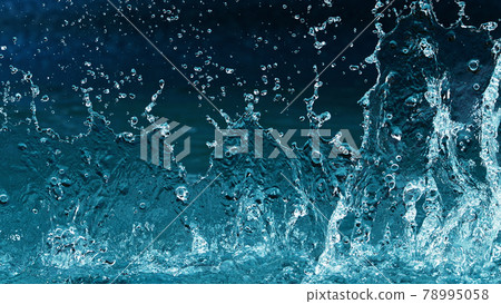 Abstract water splashes isolated on blue background Abstract water splashes isolated on blue background 78995058