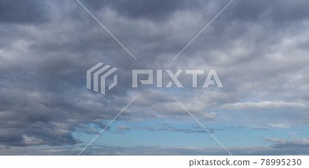 Cloudy pre-stormy sky as a background. Dramatic heaven. 78995230