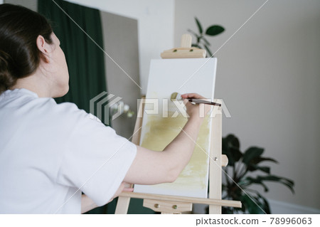 Creative occupation. The artist work with oil paints. Fine art on white canvas in the studio Creative occupation. The artist work with oil paints. Fine art on white canvas in the studio 78996063