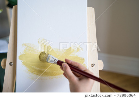 The artist paints a picture with a brush, a close-up. Abstract drawing 78996064