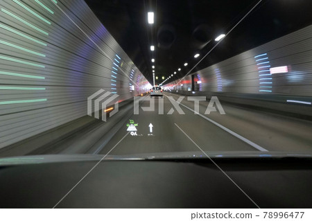 A car running through a tunnel 78996477
