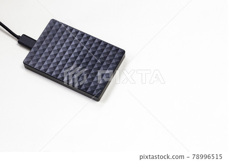 External hard disk drive isolated on white background, modern design for storage computer, laptop. Copy space,top view External hard disk drive isolated on white background, modern design for storage computer, laptop. Copy space,top view 78996515