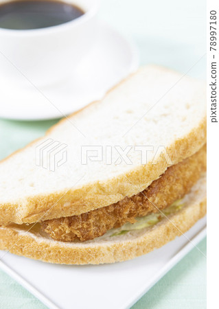 Delicious fish fry sandwich and coffee Delicious fish fry sandwich and coffee 78997180