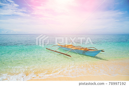 Landscape view of the beach, turquoise sea in summer, fishing boat Landscape view of the beach, turquoise sea in summer, fishing boat 78997192