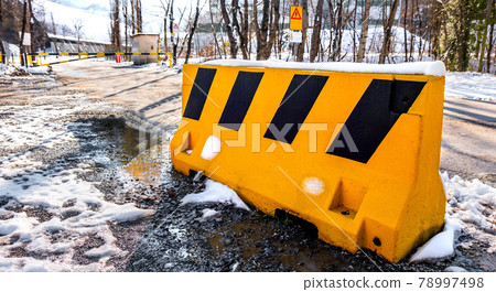 guard rail bollard on blocked read due to bad weather snow winter horizontal background guard rail bollard on blocked read due to bad weather snow winter horizontal background 78997498