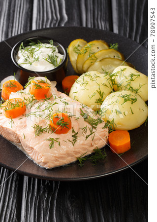 Cold poached salmon kall inkokt lax with new potatoes closeup in the plate. Vertical Cold poached salmon kall inkokt lax with new potatoes closeup in the plate. Vertical 78997543