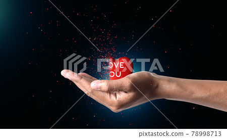 heart Dispersing in hand Red love heart dispersing levitating upon an outstretched female hand against white background. Love concept. heart Dispersing in hand Red love heart dispersing levitating upon an outstretched female hand against white background. Love concept. 78998713