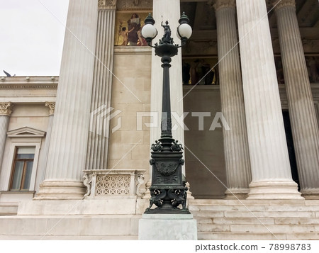 street lamp in front of a beautiful building, building in antique style, office building 78998783