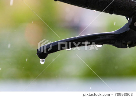 Bicycle getting wet in the rain Bicycle getting wet in the rain 78998808