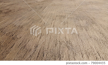 Plowed agricultural field, aerial view. Agricultural land. Background. Plowed agricultural field, aerial view. Agricultural land. Background. 79004435